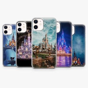 May include: A collection of five phone cases featuring iconic Disney castle designs. Each case showcases a different castle scene, with vibrant colors and detailed artwork. The cases are designed to fit a smartphone.