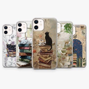 May include: Five smartphone cases with cat-themed designs. The cases display illustrations of cats with books, floral arrangements, and vintage-style imagery. The cases are designed to fit a smartphone.