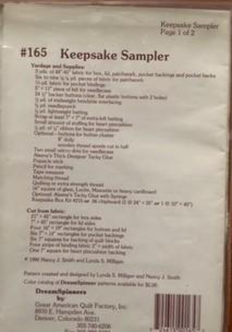 May include: A printed paper titled "Keepsake Sampler" with the text "Page 1 of 2" at the top. The title "Keepsake Sampler" is above the number "#165". The paper includes a list of yards and supplies, and cut fabric measurements. The DreamSpinners logo is at the bottom.