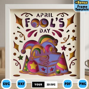 May include: A framed paper cut design for April Fool's Day. The artwork features the text "APRIL FOOL'S DAY" with a jester's hat, stars, and confetti. The design is in shades of purple, yellow, green, and pink. Includes SVG, DXF, PDF, and PNG file formats.