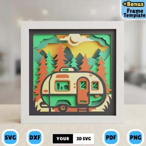 May include: A layered paper art piece depicting a campervan in a forest setting. The campervan is beige, green, and orange, set against a backdrop of trees, mountains, and a yellow sky. The artwork is framed in a white shadow box. The image includes the text "YOUR 3D SVG".