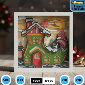 May include: A layered paper art piece in a white frame, featuring a green and red Christmas house design with snow accents. The artwork includes the text "+Bonus Frame Template" and various file type icons: SVG, DXF, PDF, and PNG. The overall theme is festive.