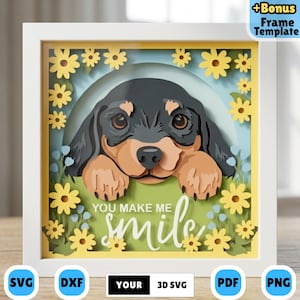 May include: A framed paper art piece depicting a black and tan dachshund dog with the words "You Make Me Smile." The design includes yellow flowers and a white frame. Available in SVG, DXF, PDF, and PNG formats.