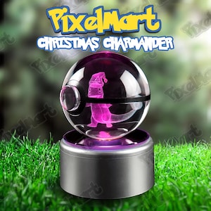 May include: A clear glass sphere with a black band, housing a pink Charmander figure wearing a Santa hat. The sphere sits on a silver base with a purple glow, with the text "PixelMart Christmas Charmander" above.