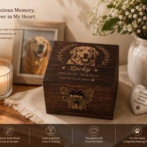 May include: A dark brown wooden pet urn box featuring a laser-engraved portrait of a dog, the name Lucky, and the dates 2012.05.10 - 2024.04.15. The box has a decorative brass butterfly latch on the front and a smooth, polished wood finish.