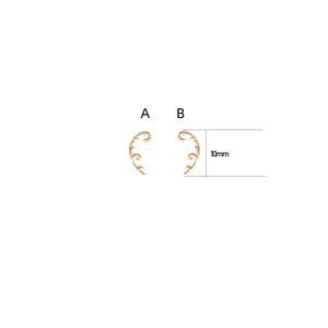 May include: Two gold-colored ear cuffs with a swirling, floral design. The image shows the ear cuffs side-by-side, with a measurement of 10mm. The ear cuffs have a delicate, elegant appearance.