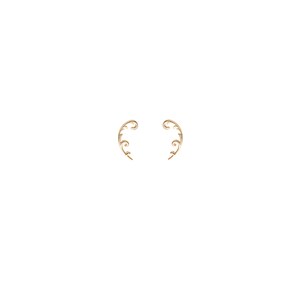 May include: A pair of gold-colored ear cuffs. Each cuff features a delicate, swirling vine design with small, subtle details. The ear cuffs curve gracefully, designed to be worn along the ear's edge, adding a touch of elegance.