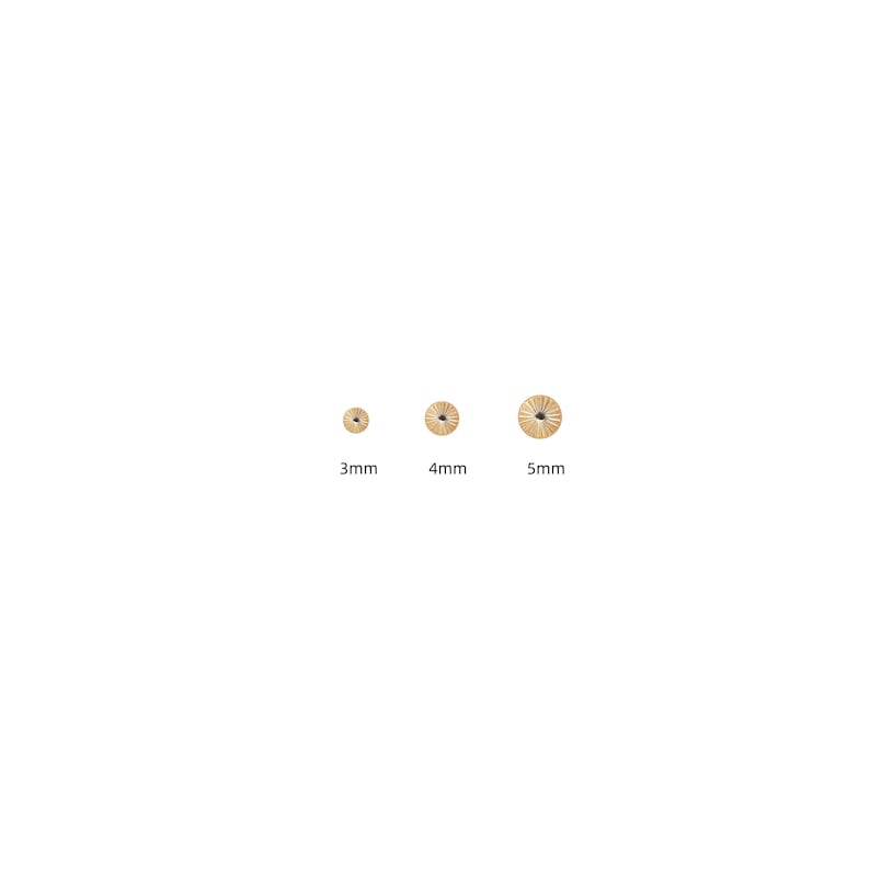 May include: Three small, gold-colored, circular beads with radial grooves. The beads are labeled with their sizes: 3mm, 4mm, and 5mm. The beads are arranged in a row against a white background.