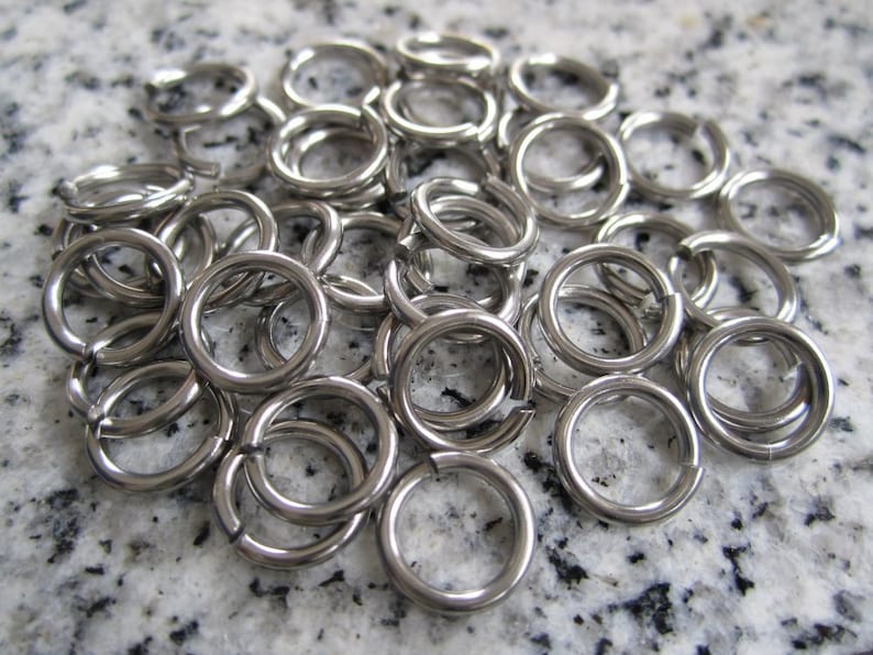 100 Qty. 8mm OD, 5.6mm ID, 18g 1.2mm Saw Cut Stainless Steel Jump Rings JR18-08 image 1