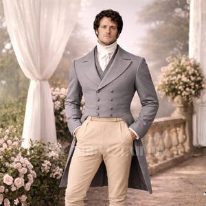 May include: A light gray double-breasted tailcoat suit with a matching vest and cream-colored trousers. The suit features a high collar shirt and is set in an outdoor garden setting.