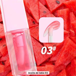 May include: A pink lip gloss tube with a clear applicator, filled with a pink liquid. The background features red watermelon slices. A small square shows a close-up of the applicator with gloss. The text "03#" is visible.