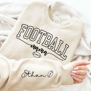 Football Mom Shirt With Kids Name on Sleeve, Personalized Mama Football Sweatshirt, Custom Cheer Mom Outfit, Game Day Football Shirt