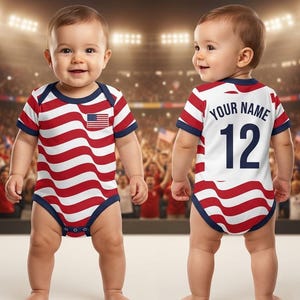 May include: A baby bodysuit featuring a red and white wavy stripe pattern with dark blue trim. The front displays a small American flag patch. The back features a white panel with the text YOUR NAME and the number 12 in dark blue lettering.