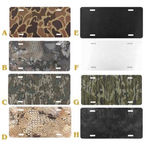 May include: Eight license plates with different camouflage patterns. The plates are rectangular with four mounting holes. The patterns include brown, green, and tan camouflage designs, as well as solid black and white options.