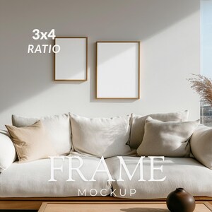 May include: Two rectangular wooden frames with white inserts are mounted on a light wall above a beige sofa. The text 3x4 RATIO and FRAME MOCKUP is visible. The frames are positioned side by side, featuring a clean, simple design for displaying art.