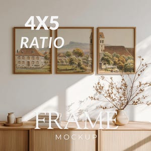 May include: Three framed landscape art prints with a 4x5 ratio. The prints depict watercolor paintings of European buildings and scenery. The frames are a warm brown color. The word "FRAME" and "MOCKUP" are displayed in white text.