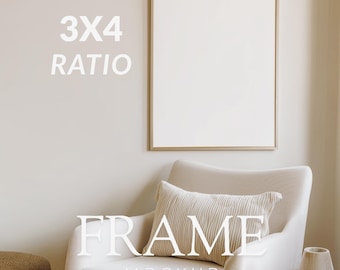May include: A framed art mockup with a gold frame, displayed above a cream-colored armchair. The text "3X4 RATIO" and "FRAME MOCKUP" are visible. A decorative pillow and small wooden side table with a vase are also in the image.