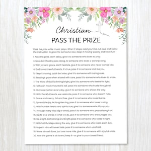 May include: A white card with the text "Christian PASS THE PRIZE" surrounded by a floral design. The card contains instructions for a game. The top of the card has a cross illustration.