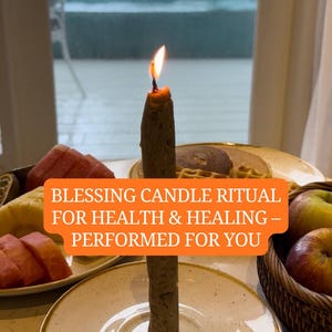 May include: A lit brown candle on a white plate with the text "Blessing Candle Ritual for Health & Healing - Performed for You." Sliced fruit and a basket of apples are in the background.