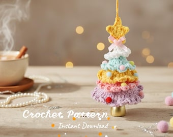 May include: A tiered crochet Christmas tree ornament featuring layers of pastel purple, pink, yellow, and light blue yarn, topped with a yellow star and a small pink bow. The tree stands on a gold base and is decorated with tiny colorful pom-poms.