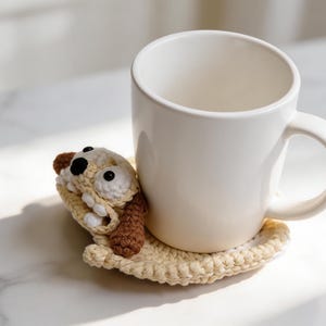 dog animal coaster crochet pattern holding a coffee mug, cute pop-up crochet mug rug design