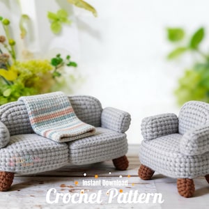May include: A miniature gray crochet sofa and armchair set with brown feet. A small blanket with pastel stripes rests on the sofa. The words "Instant Download Crochet Pattern" are at the bottom.