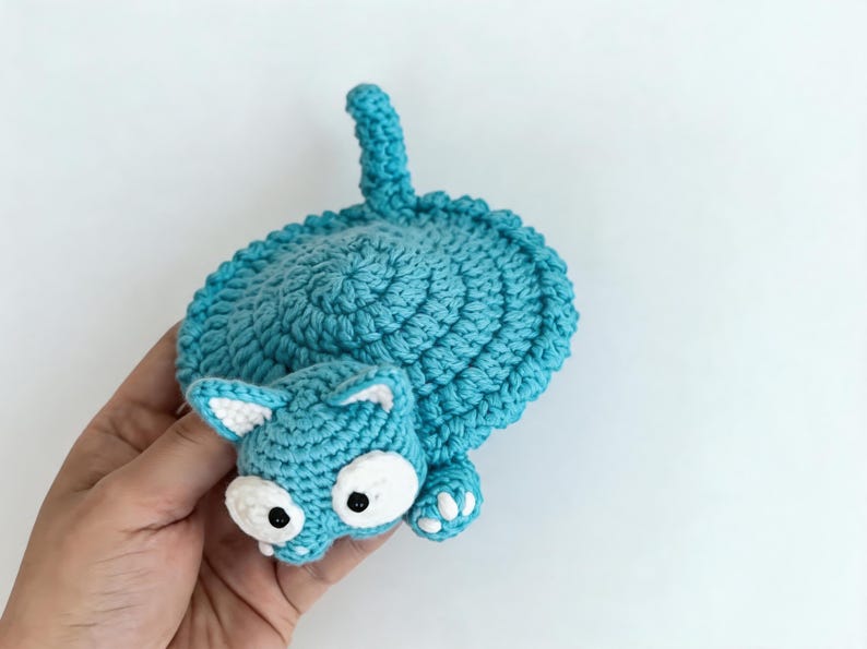 pop up cat crochet coaster in hand