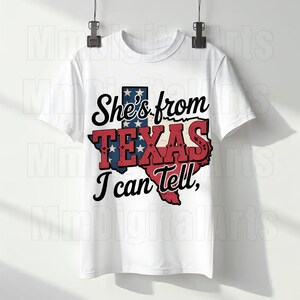May include: White t-shirt with the phrase "She's from TEXAS I can tell," and a Texas-shaped graphic in red, white, and blue. A patriotic design, ideal for those with Texan pride.