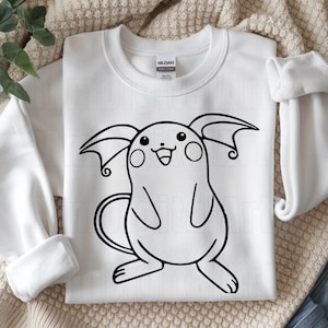May include: White sweatshirt featuring a black outline illustration of a cartoon character with large ears, a tail, and a smiling face. The sweatshirt has a crew neck and long sleeves.