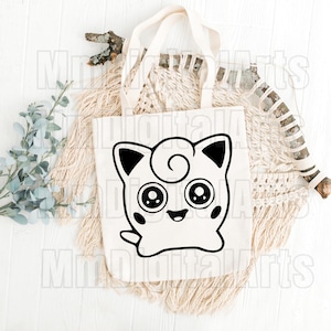 May include: A white tote bag featuring a black and white cartoon character design. The character has large eyes, a smiling mouth, and a swirl on its head. The bag has a simple design with a rectangular shape and two handles.