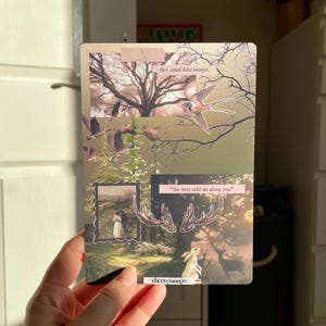 May include: A rectangular art print with a collage of nature scenes. It features a tree, birds, a deer, a rabbit, and a framed image of a couple. Text includes "her soul has wings" and "the trees told me about you".