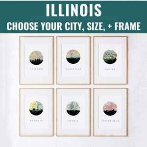 May include: Six framed art prints featuring Illinois city skylines in a circular design. Each print includes a city name: Chicago, Champaign, Moline, Mendota, Peoria, and Springfield. The text "ILLINOIS" and "CHOOSE YOUR CITY, SIZE, + FRAME" are at the top.