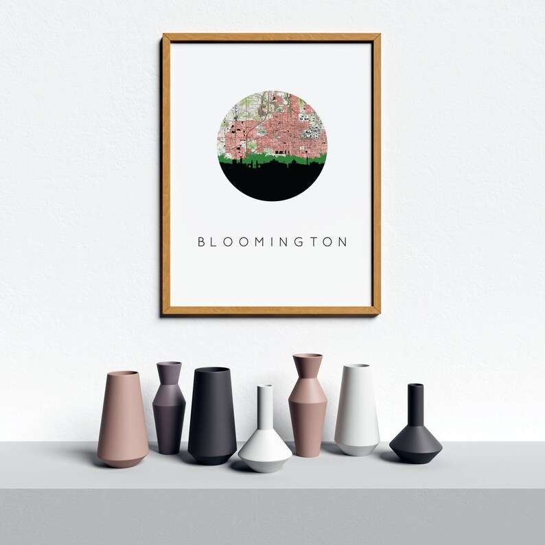Bloomington Indiana art print featuring the Bloomington Indiana skyline and a Bloomington Indiana city map. Available in several cities and frame options. Bloomington Indiana shown in a brown frame. Designed by www.etsy.com/shop/paperfinchdesign