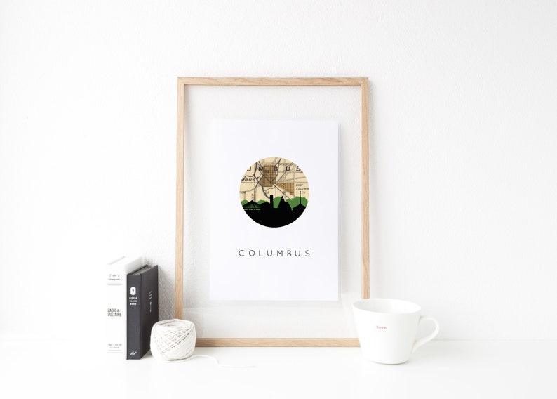 Columbus Indiana art print featuring the Columbus Indiana skyline and a Columbus Indiana city map. Available in several cities and frame options. Columbus Indiana shown in a brown frame. Designed by www.etsy.com/shop/paperfinchdesign