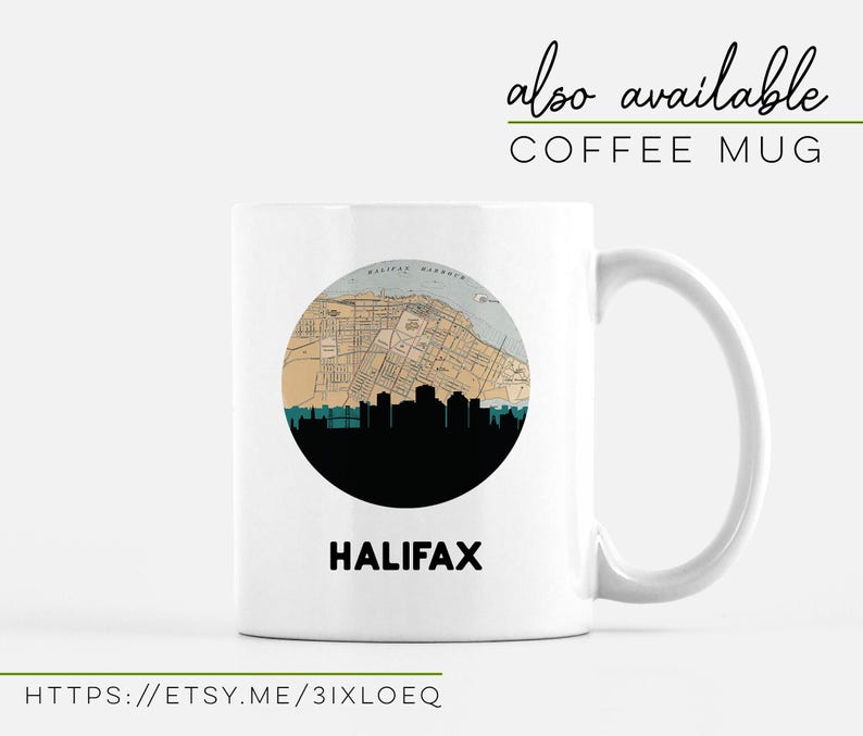 A white coffee mug features a circular Halifax map and skyline graphic with the city name underneath.