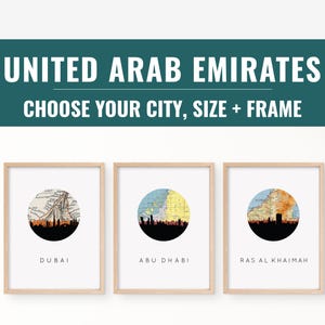 May include: Three framed art prints featuring city skylines of Dubai, Abu Dhabi, and Ras Al Khaimah, United Arab Emirates. Each print has a circular map design with a black silhouette of the city skyline. The text "UNITED ARAB EMIRATES" and "CHOOSE YOUR CITY, SIZE + FRAME" are at the top.