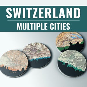 May include: Four round coasters with vintage map designs and city silhouettes. The coasters feature a teal and black color scheme, with the word "SWITZERLAND" and "MULTIPLE CITIES" in white text at the top.
