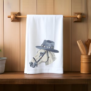 Horse tea towel with quirky white equine in cowboy hat, perfect for drying dishes or a fun kitchen gift for horse lovers!