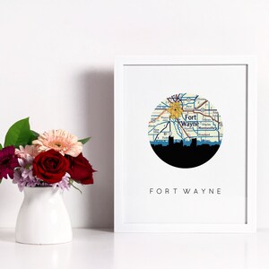 Fort Wayne Indiana art print featuring the Fort Wayne Indiana skyline and a Fort Wayne Indiana city map. Available in several cities and frame options. Fort Wayne Indiana shown in a white frame. Designed by www.etsy.com/shop/paperfinchdesign