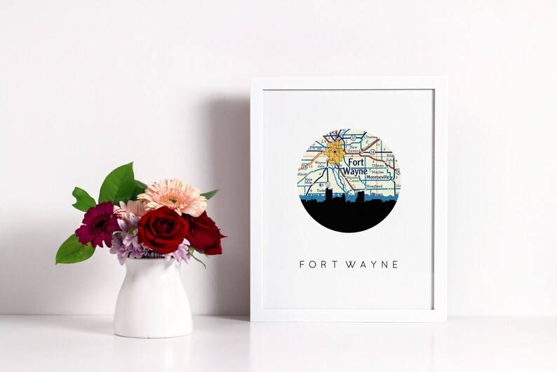 Fort Wayne Indiana art print featuring the Fort Wayne Indiana skyline and a Fort Wayne Indiana city map. Available in several cities and frame options. Fort Wayne Indiana shown in a white frame. Designed by www.etsy.com/shop/paperfinchdesign