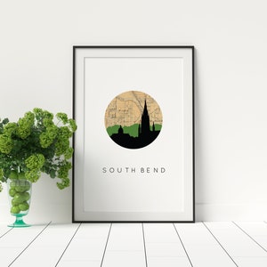 South Bend Indiana art print featuring the South Bend Indiana skyline and a South Bend Indiana city map. Available in several cities and frame options. South Bend Indiana shown in a black frame. Designed by www.etsy.com/shop/paperfinchdesign