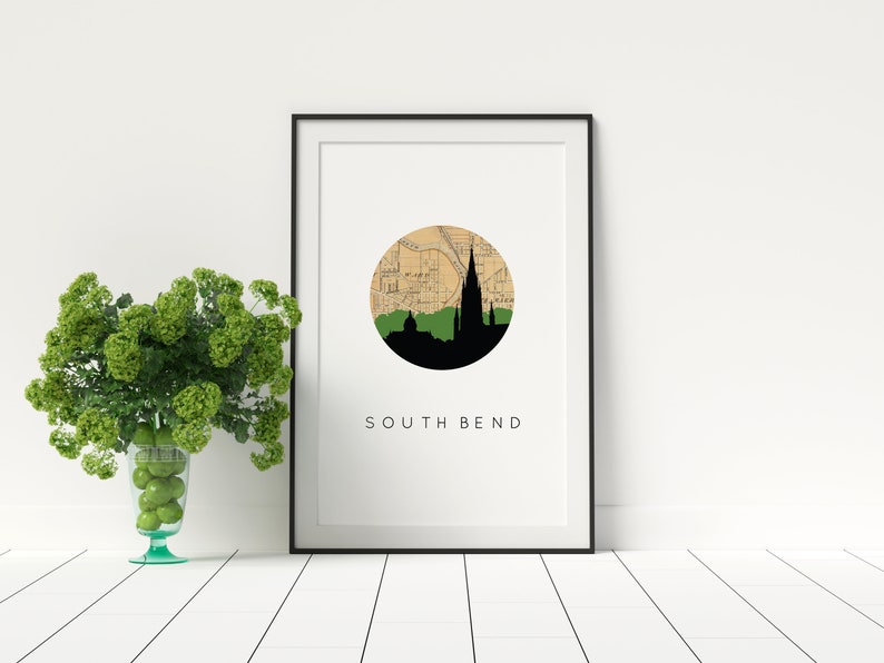 South Bend Indiana art print featuring the South Bend Indiana skyline and a South Bend Indiana city map. Available in several cities and frame options. South Bend Indiana shown in a black frame. Designed by www.etsy.com/shop/paperfinchdesign