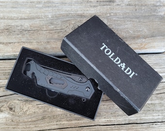 TOLDADI 7-in-1 Tactical Folding Knife - Spring Assisted Tool with Glass Breaker & Seatbelt Cutter - Never Used (Box Scuffed)