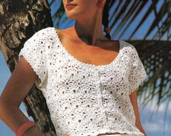 May include: White crochet top with a scoop neck and short sleeves. The top has a button fastening at the front.