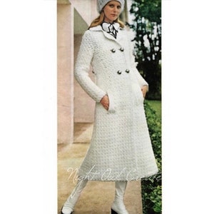 May include: A white crocheted coat with a double breasted closure and two pockets. The coat has a collar and is worn with a white hat and white boots.