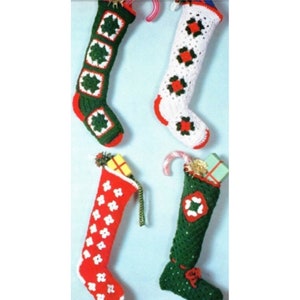May include: Four handmade Christmas stockings in various colors. Two are green with white and red accents, and two are red with white accents. Each stocking has a unique crochet design and is filled with small gifts and candy canes.