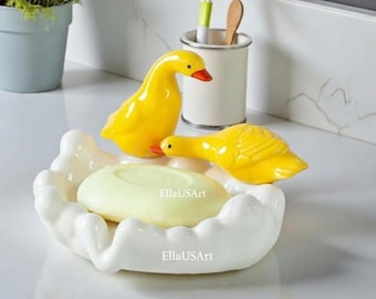 Jabonera con forma de pato con drenaje automático, soporte de baño de resina con diseño de cascada