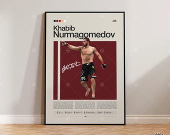 May include: A framed poster featuring Khabib Nurmagomedov in a fighting stance. The poster has a burgundy background with the fighter's name and signature in white. The poster includes the text "Khabib Nurmagomedov" and the number "/88".