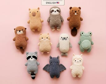 May include: A digital PDF pattern in English featuring ten plush animal toys including a capybara, sloth, beaver, otter, hamster, seal, frog, raccoon, bat, and llama. Each toy has a textured, fuzzy appearance and a simple, friendly facial expression.