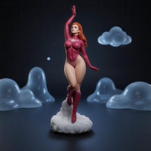 May include: A collectible figurine of a female character with long orange hair, wearing a magenta bodysuit with a circular chest emblem and matching boots. The figure is posed dynamically, standing atop a white cloud base with floating clouds.
